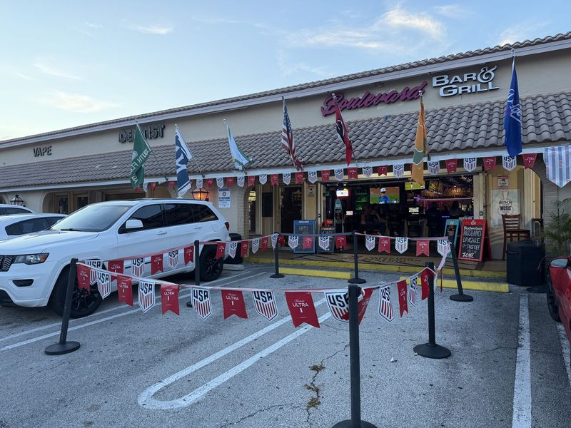 The Boulevard Bar & Grill storefront and patio at 1403 Boynton Beach Blvd, Boynton Beach, FL